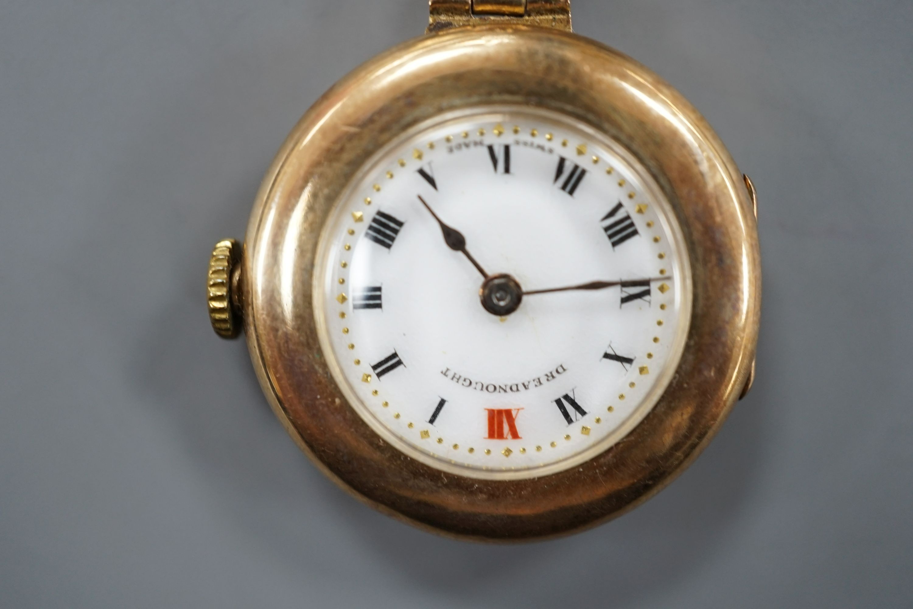 A lady's 9ct 'Dreadnought' fob watch, on a 9ct gold suspension brooch, gross weight 18.5 grams.